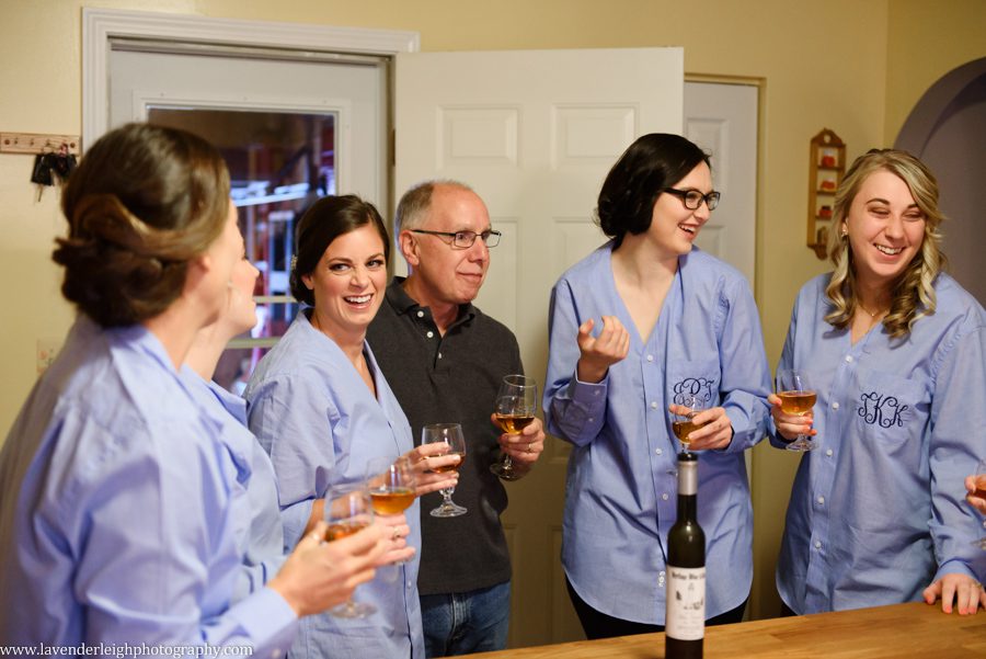 bride toasts wine with bridesmaids, the Hyeholde restaurant, castle, Pittsburgh Pennsylvania wedding and engagement photographer