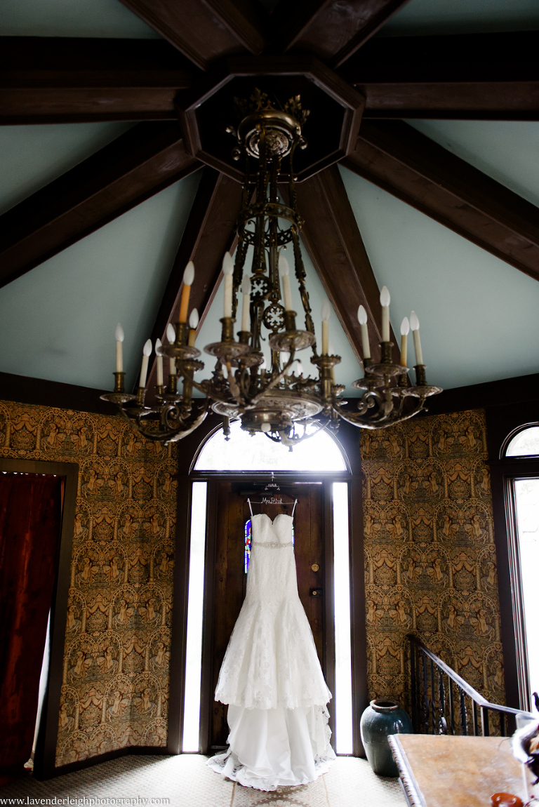 Strapless Lace Wedding Dress, hanging in the Hyeholde restaurant, castle, Pittsburgh Pennsylvania wedding and engagement photographer