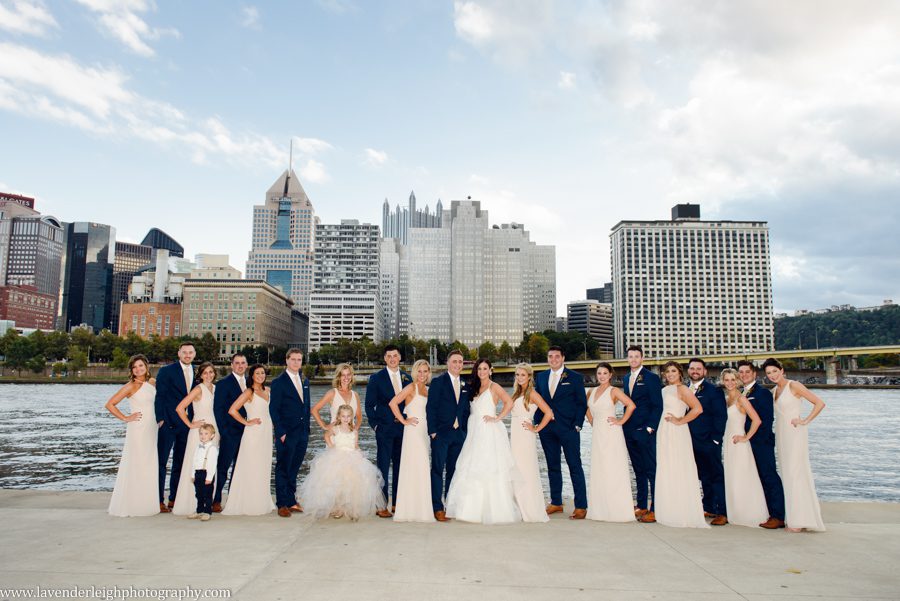 The bridal party poses for a picture with the Pittsburgh city skyline