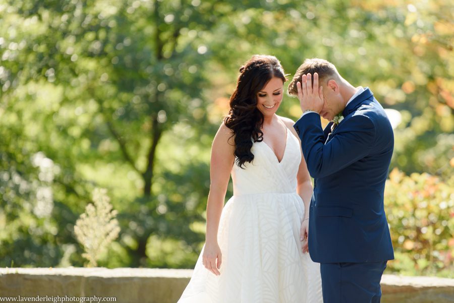 The bride and groom have a fist look at Point State Park in Pittsburgh, Pennsylvania
