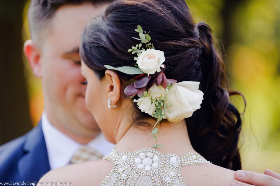 The bride wore real flowers in her hair, and had a stunning hairstyle