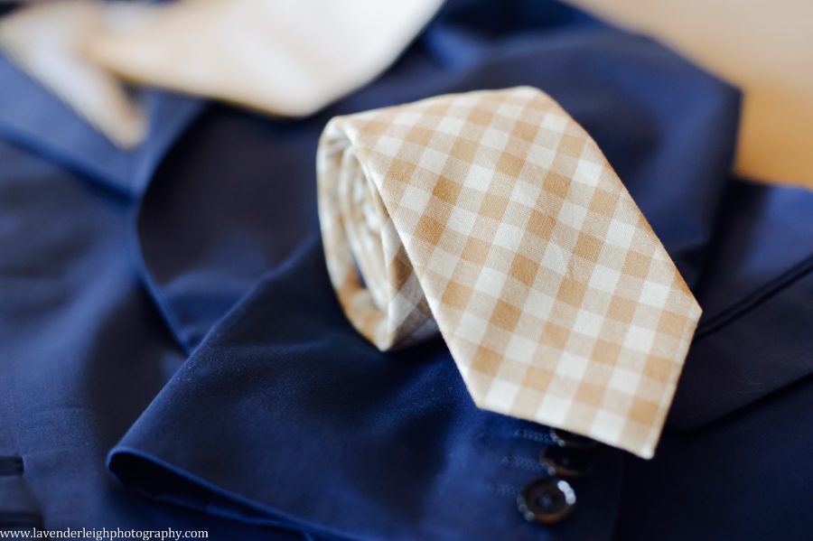 Gold checkered groomsmen's ties were gold checkered and blue suits at the Wyndham Grand Pittsburgh Downtown