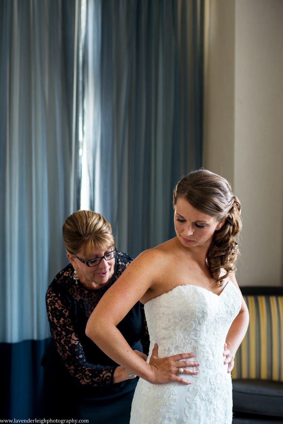 Bride Putting on Wedding Dress | Mother Helping | Wedding Dress | Maggie Sottero | Exquisite Bride | Lace Wedding Dress | White Wedding Dress | Getting Ready | Renaissance Hotel | Oakmont Country Club Wedding | Getting Ready Pictures |  Pittsburgh Wedding Photographer | Pittsburgh Wedding
