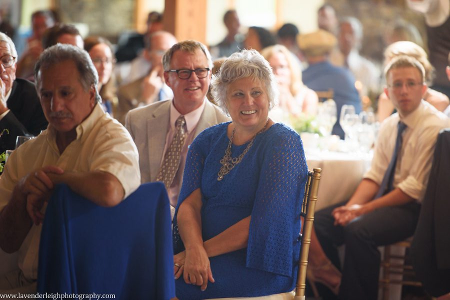 Guests laughing at wedding Toasts