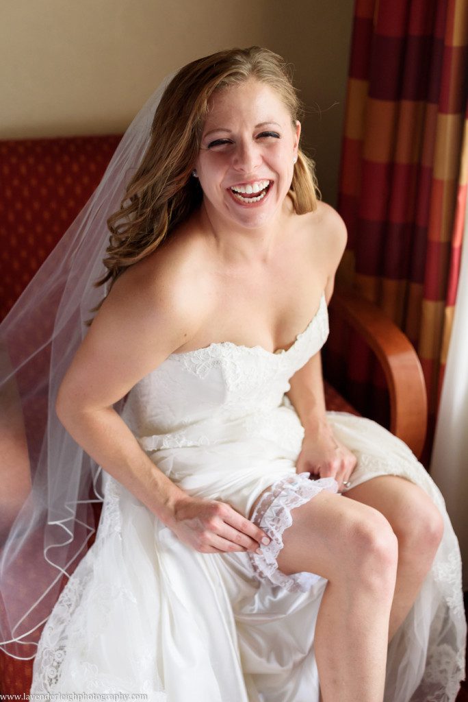 The bride pulls up her garter