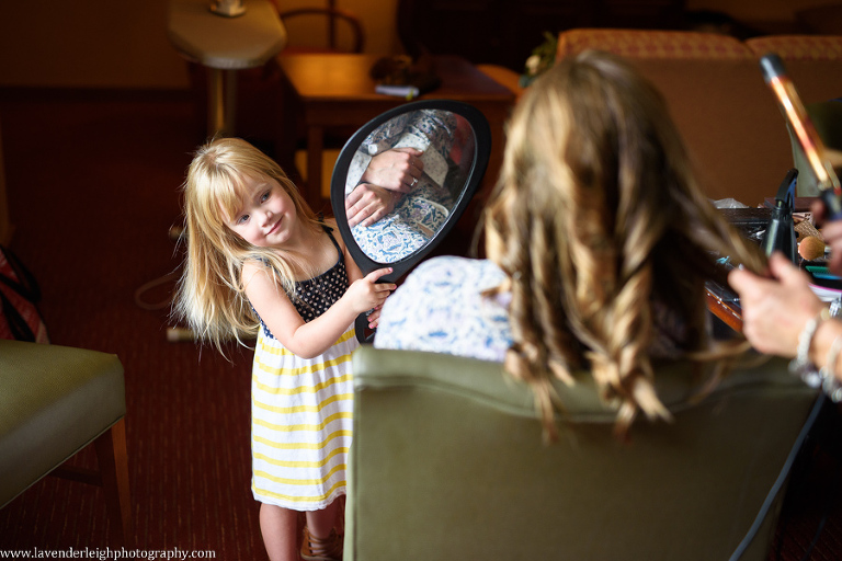 flower girl admires bride