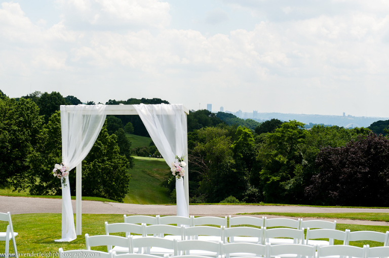 summer wedding, ceremony, white chairs, sunny day, altar, whispy canopy