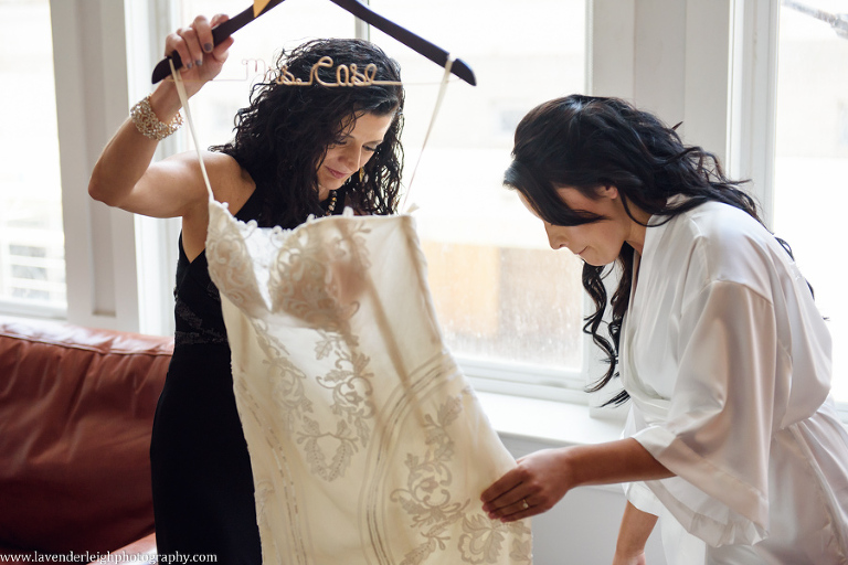 Mother Helps Bride with Dress