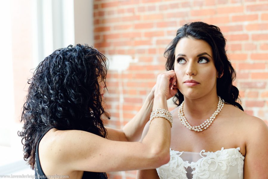 Bride Putting on Jewelry