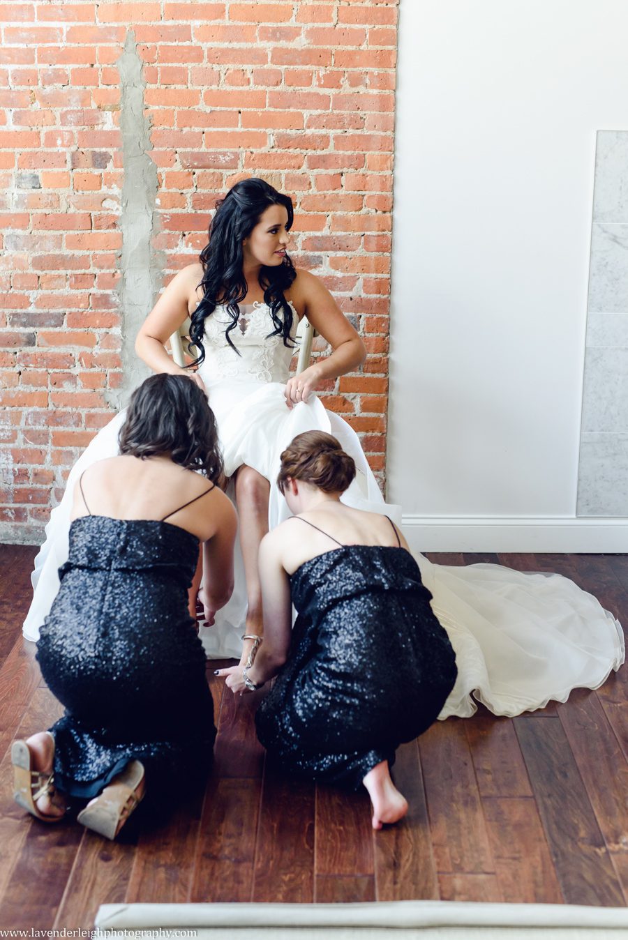 Two Bridesmaids Help the Bride