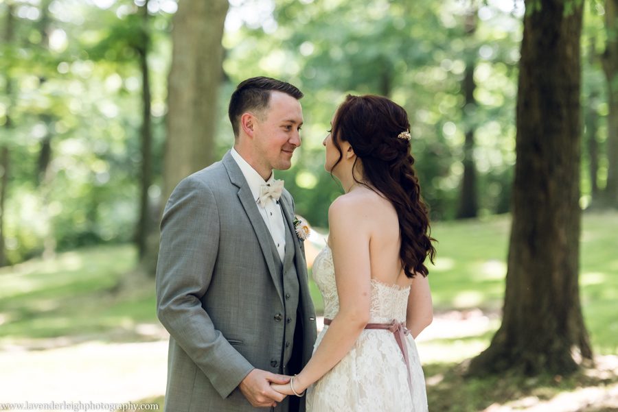 <alt>groom sees bride during first look in parrish park</alt>