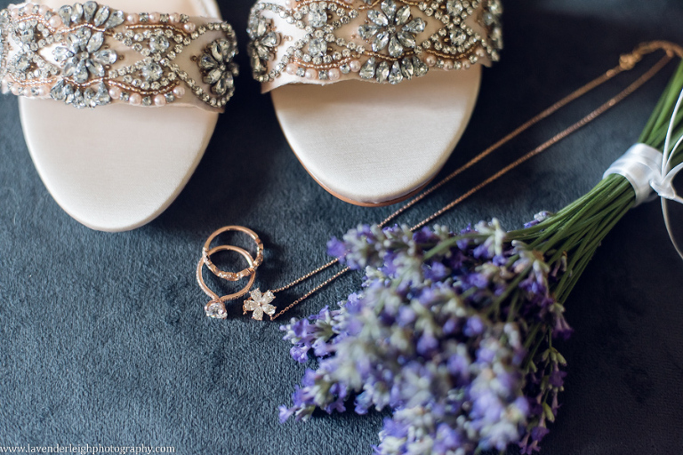 rose gold wedding rings and necklace