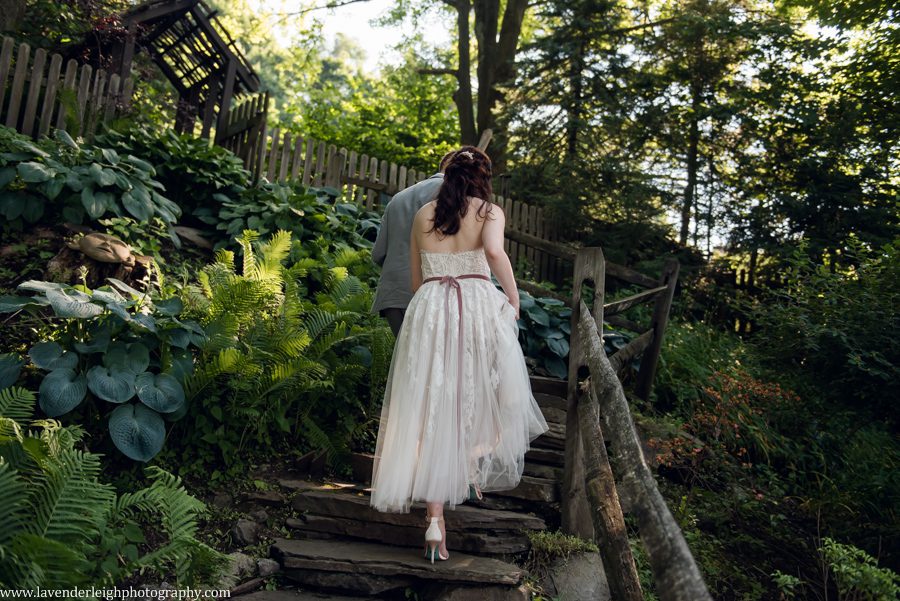 <alt>groom walking with bride through Choderwood in Pittsburgh, Pennsylvania</alt>